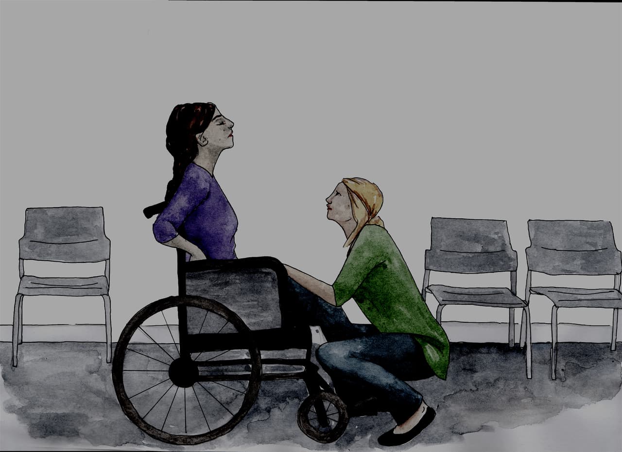 A disabled woman with a support worker in a refuge