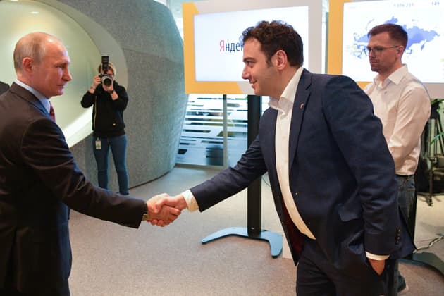 Vladimir Putin shakes hands with Tigran Khudaverdyan at Yandex's offices in Moscow in 2017
