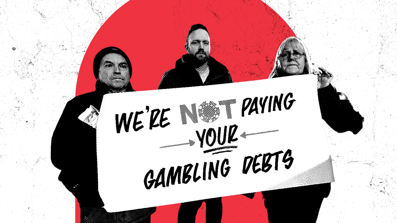 Three people hold a banner that reads: We're not paying your gambling debts