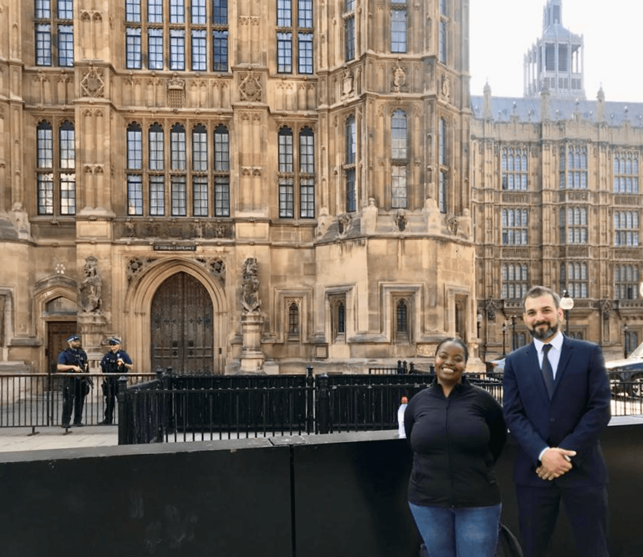 TBIJ's Emiliano Mellino and Sybil Msezane outside the House of Lords