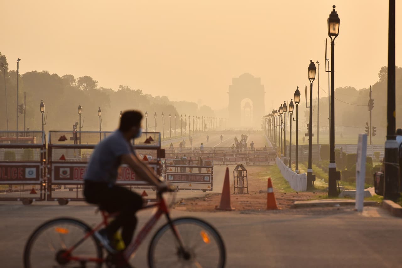 A man rides his bike through Delhi