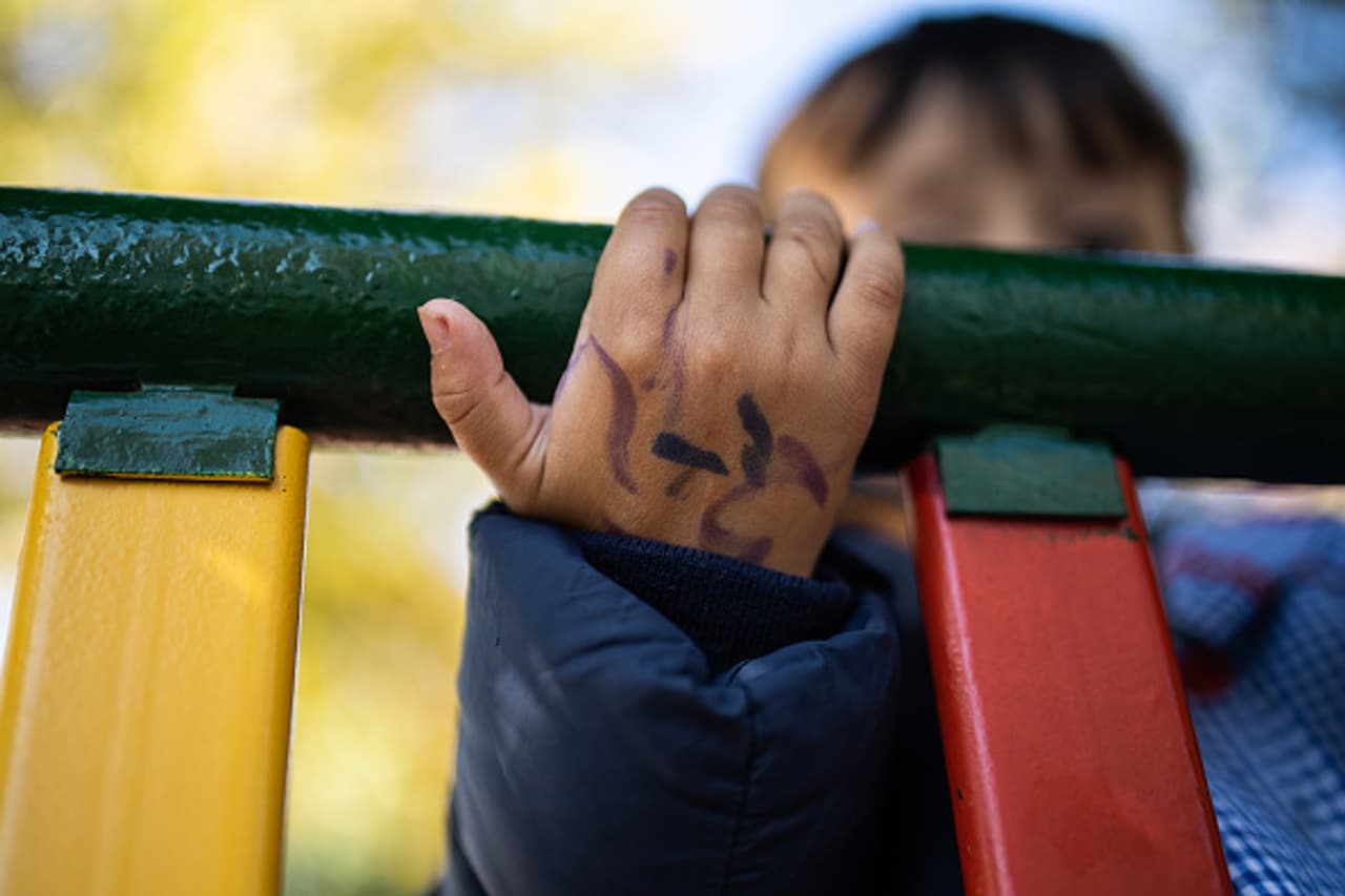 A child on a climbing frame at a park