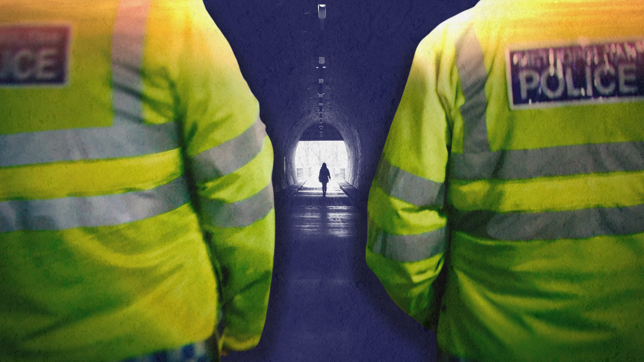 A composite image shows the backs of two metropolitan police officers in the foreground. Between them, a silhouetted woman walks alone through a tunnel