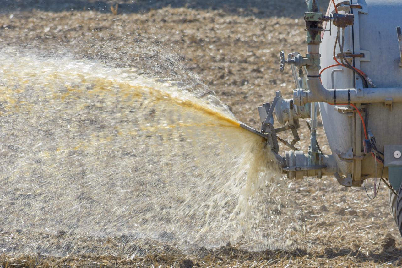 Tractor spraying slurry