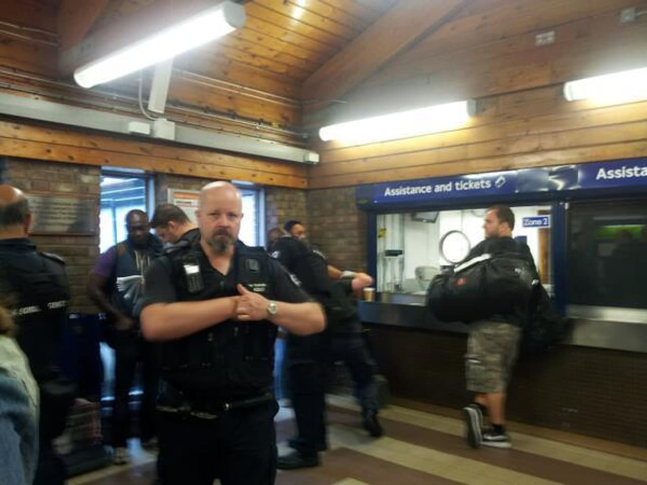 An image of an immigration raid at a London tube station